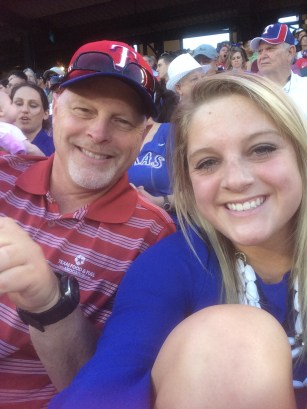 Watching the Rangers with her dad